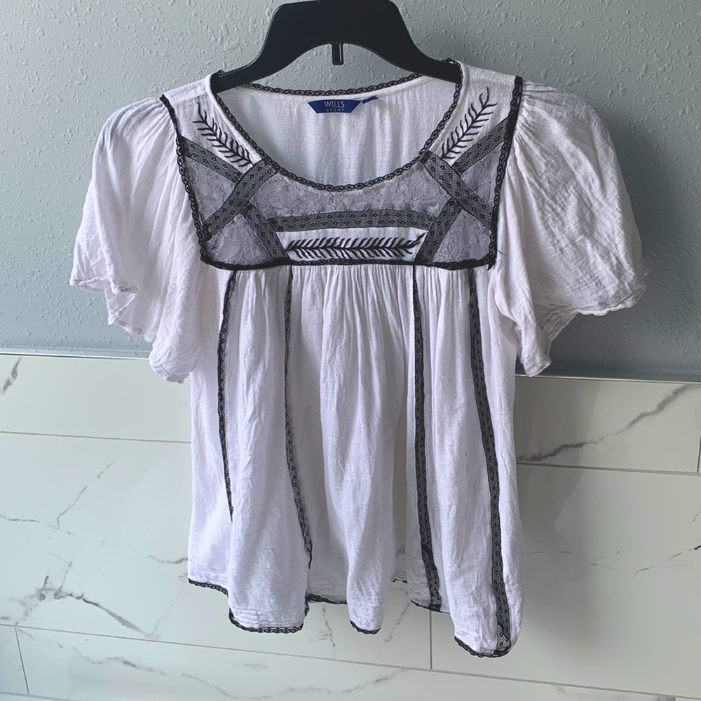 Beautiful white blouse with black lace design